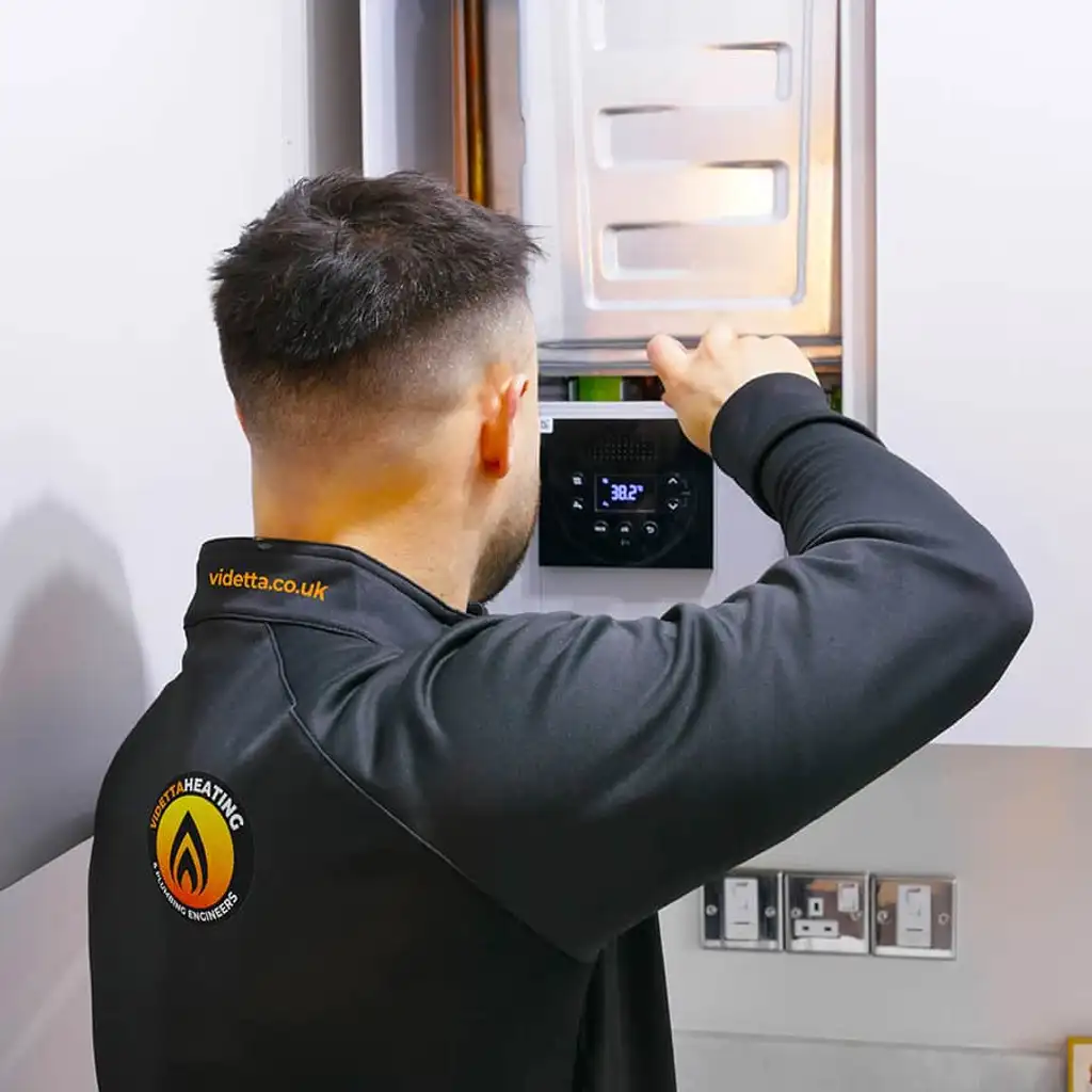 A Gas Safe engineer repairing a boiler